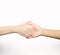 Closeup thumb wrestle between two people, a symbol of competition isolated on white background