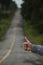 Closeup of a Thumbs up of a Caucasian Woman Hitchhiking