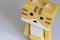 Closeup of a tiger colored Danbo Toy on white background