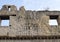 Closeup tile and face outside wall of a house in Parco Archeologico di Ercolano