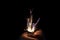 Closeup to hand igniting fire lighters with black background