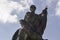 Closeup to a Saint francis xavier baroque sculpture with blue cloudy sky