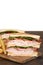 Closeup toasted turkey club sandwich with fries