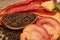 Closeup Tomaten, Red hot chili peppers and black pepper whole in wooden spoon on old wooden background