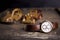 Closeup toned shot of male watches lying on table against retro