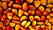 Closeup top shot of a mosaic of colored gemstones, amber - seamless pattern.