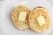Closeup top view english crumpets with butter