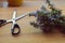 Closeup, top view of Mediterranean herb bouquet/ rosemary bouquet whit retro scissors at wooden table