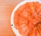 Closeup top view Slided Raw Salmon in white dish on wood blackground