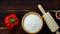 Closeup top view studio shot of white powder bakery flour in wood bowl red sweet pepper ingredient in ceramic cup and wooden