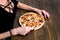 CLOSEUP Top view VERY HOT SLICED Italian Pizza with hand take a slice on wooden table with mushrooms, tomato, olives and