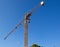 Closeup tower crane on blue sky