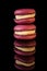 Closeup tower of two purple macaroons with yellow filling