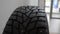 Closeup tracking shot of new rubber tire in dealership office. Close up of new modern car tyre for automobile wheel at