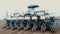 Closeup of Tractor with seeder in the field. Sowing of corn, Maize in soil, with pneumatic sowing machine during spring