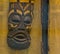 Closeup of a traditional african mask on a wooden wall, cultural and spiritual decorations