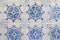 Closeup of traditional Portuguese ceramic tiles. Blue vintage azulejo with decorative ornaments. Morrocan styled pattern