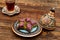 Closeup of traditional Turkish dessert - baklava (violet baklava) on wooden background. Side view