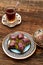Closeup of traditional Turkish dessert - baklava (violet baklava) on wooden background. Sidw view