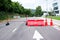 Closeup traffic barriers on the road with arrow sign background