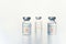 Closeup transparent vials with new vaccine for covid-19 coronavirus, flu, infectious diseases. Injection after clinical trials for