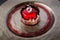 closeup trendy red mirror glazed mousse cake in apple shape