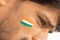 Closeup of a Tricolor Indian flag Painted on face to cheer India in cricket sports