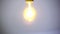 Closeup of turning on tungsten bulb, incandescent lamp for interior lighting
