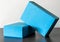 Closeup of two blue foam yoga blocks isolated in the gray background