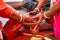 Closeup of two people doing an Indian traditional ritual