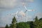 Closeup of two red and white windmills