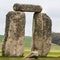 Closeup of two standing stones with horizontal lintel stone at Stonehenge in Wiltshire