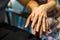 Closeup on two young lovers holding hands at a table, symbol sign sincere feelings, compassion, loved one, say sorry. Reliable