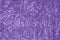 Closeup ultra violet color velvet fabric sample texture backdrop