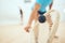 Closeup of unknown athletic squash player using a racket to hit a ball during a court game. Fit active mixed race male