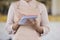 Closeup of unknown waitress in apron holds pen and notepad