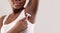 Closeup Of Unrecognizable African American Lady Shaving Underarm With Pink Razor