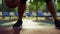 Closeup unrecognizable african guy practicing street basketball in outdoor.