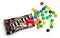 Closeup of unwrapped M&M`s milk chocolate