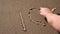 Closeup up of hand writing I love you sign on the sand at the beach. Romantic love symbol at tropical seashore at sunset
