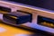 Closeup of USB flash drive inserted into port on the side of a l