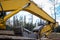 Closeup of used Boom, Bucket of Skid Steer Excavator Loader at work site