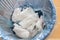 Closeup used sanitary napkin pad wrapped disposed in rubbish bin