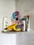 Closeup of Used Soap, Shampoo, Paste and Brushes inside the Washroom Arranged in a Stand or Shelf