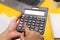 Closeup of using calculator on background stock image.