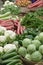 Closeup of the various fresh and healthy vegetables in the baskets in the market