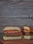 Closeup on vegan plant based burger cut in half served on wooden tray