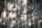 Closeup of vertical gray wooden fence panels with shadows. Vignetted. Texture or background