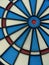 Closeup vertical shot of a blue and white dartboard