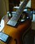 Closeup vertical shot of a brown electronic guitar